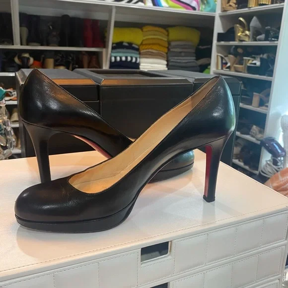 Christian Louboutin black leather pumps. Size 9… Good condition